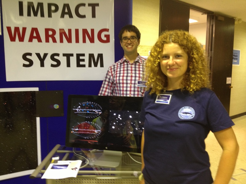 [Dr. Eva Schunova and Bryce Bolin staffing the ATLAS exhibit at the IfA Open House. Image credit: Karen Teramura, UH IfA.]