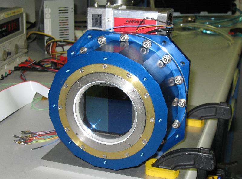 [A prototype ATLAS camera showing the CCDs mounted inside the dewar that keeps the CCDs chilled and in a vacuum. Image credit: John Tonry, University of Hawaii Institute for Astronomy.]
